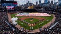 A large American flag is displayed on the field during Opening Day as the Detroit Tigers host the St. Louis Cardinals at Comerica Park