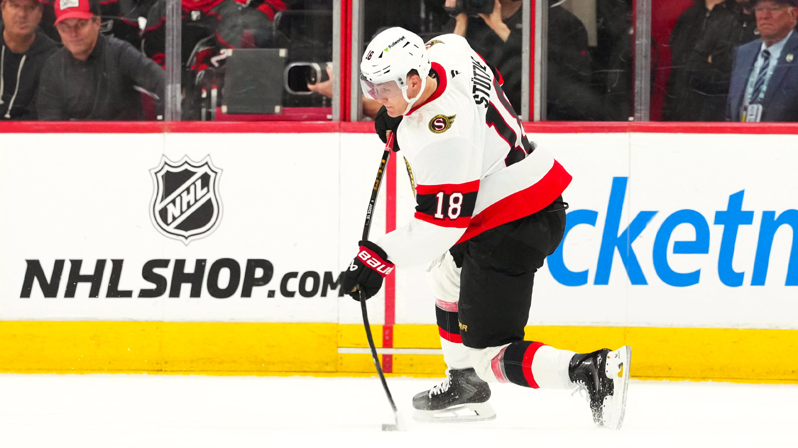 Ottawa Senators center Tim Stützle (18) takes a shot against the Carolina Hurricanes during the third period in game one of the first round of the 2026 Stanley Cup Playoffs at Lenovo Center.