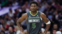 Minnesota Timberwolves guard Anthony Edwards (5) looks on during the first quarter against the Philadelphia 76ers at Xfinity Mobile Arena.