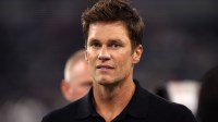 Former NFL player Tom Brady on the field before the game between the Dallas Cowboys and the Las Vegas Raiders at AT&T Stadium