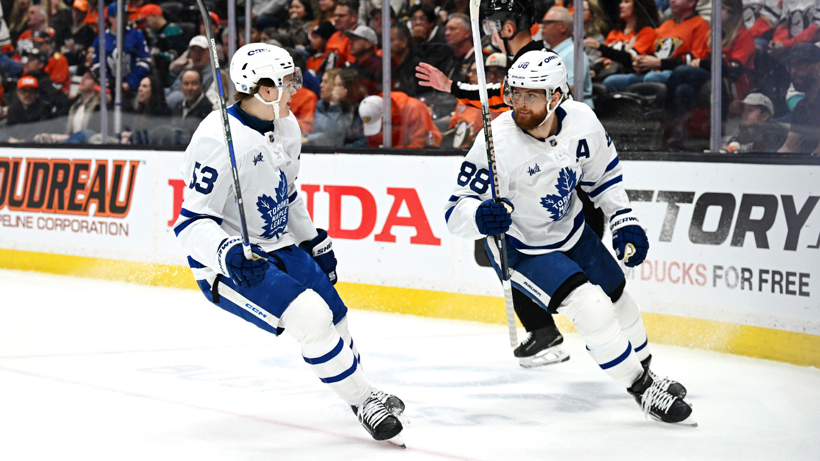 Toronto Maple Leafs right wing William Nylander (88) celebrates after scoring a goal with Toronto Maple Leafs right wing Easton Cowan (53) during the third period against the Anaheim Ducks at Honda Center.