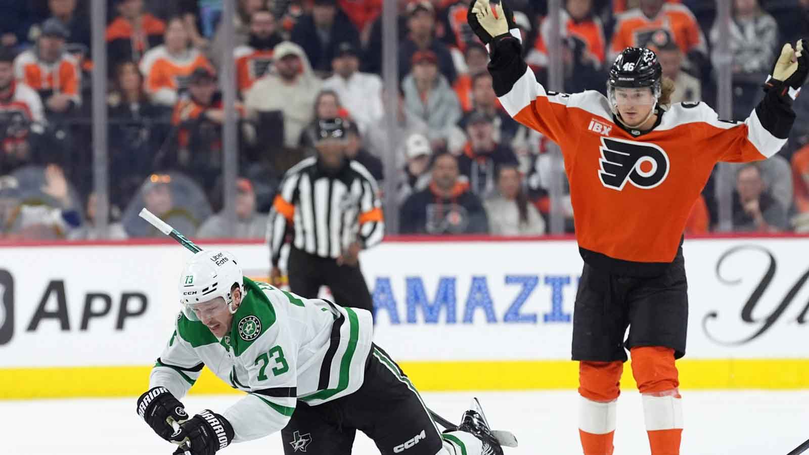  Dallas Stars left wing Adam Erne (73) trips against Philadelphia Flyers center Trevor Zegras (46) in the third period at Xfinity Mobile Arena. 
