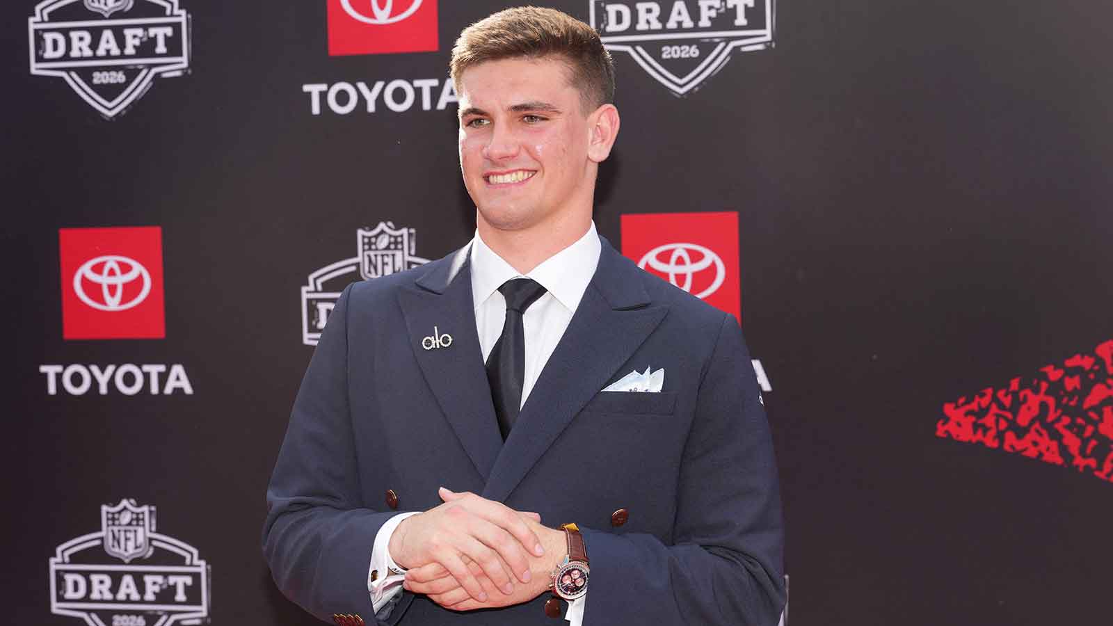 Alabama Crimson Tide quarterback Ty Simpson poses on the red carpet before the 2026 NFL Draft at Point State Park.
