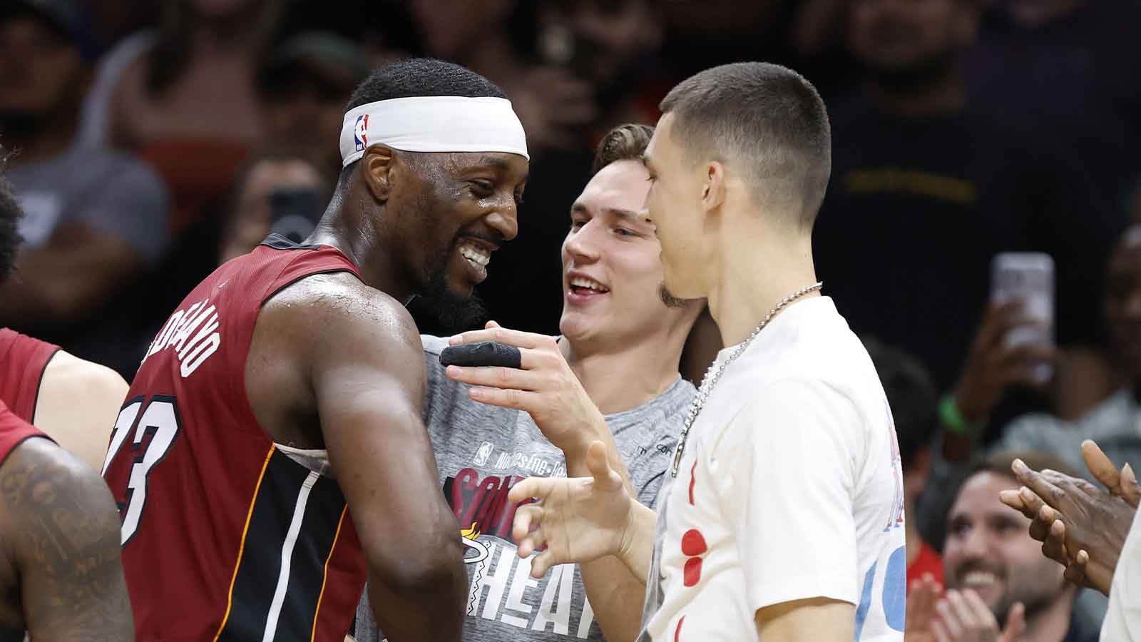 Miami Heat center Bam Adebayo (13) celebrates with guards Pelle Larsson and Tyler Herro after becoming the NBA's second highest scorer of points in a game against the Wshington Wizards at Kaseya Center.