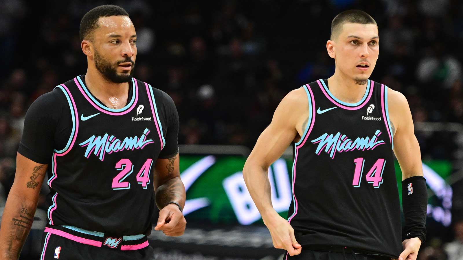 Miami Heat guard Norman Powell (24) and guard Tyler Herro (14) looks on in the third quarter against the Milwaukee Bucks at Fiserv Forum.