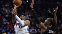 Philadelphia 76ers guard Tyrese Maxey (0) shoots over Detroit Pistons guard Daniss Jenkins (24) during the first half at Xfinity Mobile Arena.