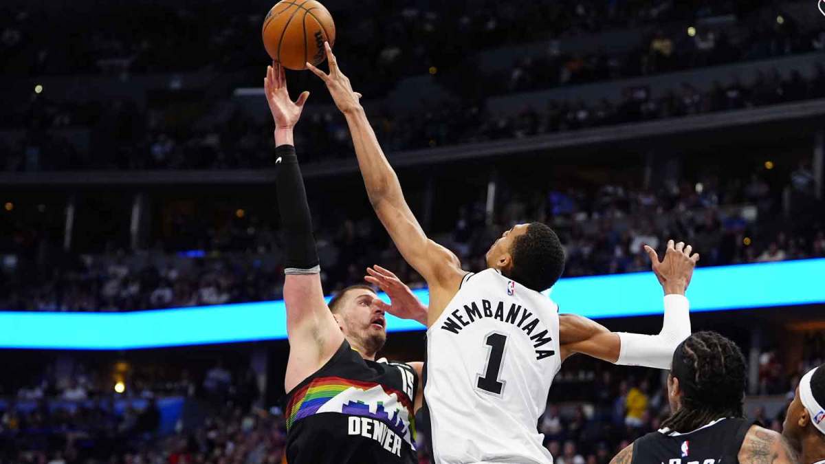 San Antonio Spurs forward Victor Wembanyama (1) blocks the shot of Denver Nuggets center Nikola Jokic (15) in the second quarter at Ball Arena.