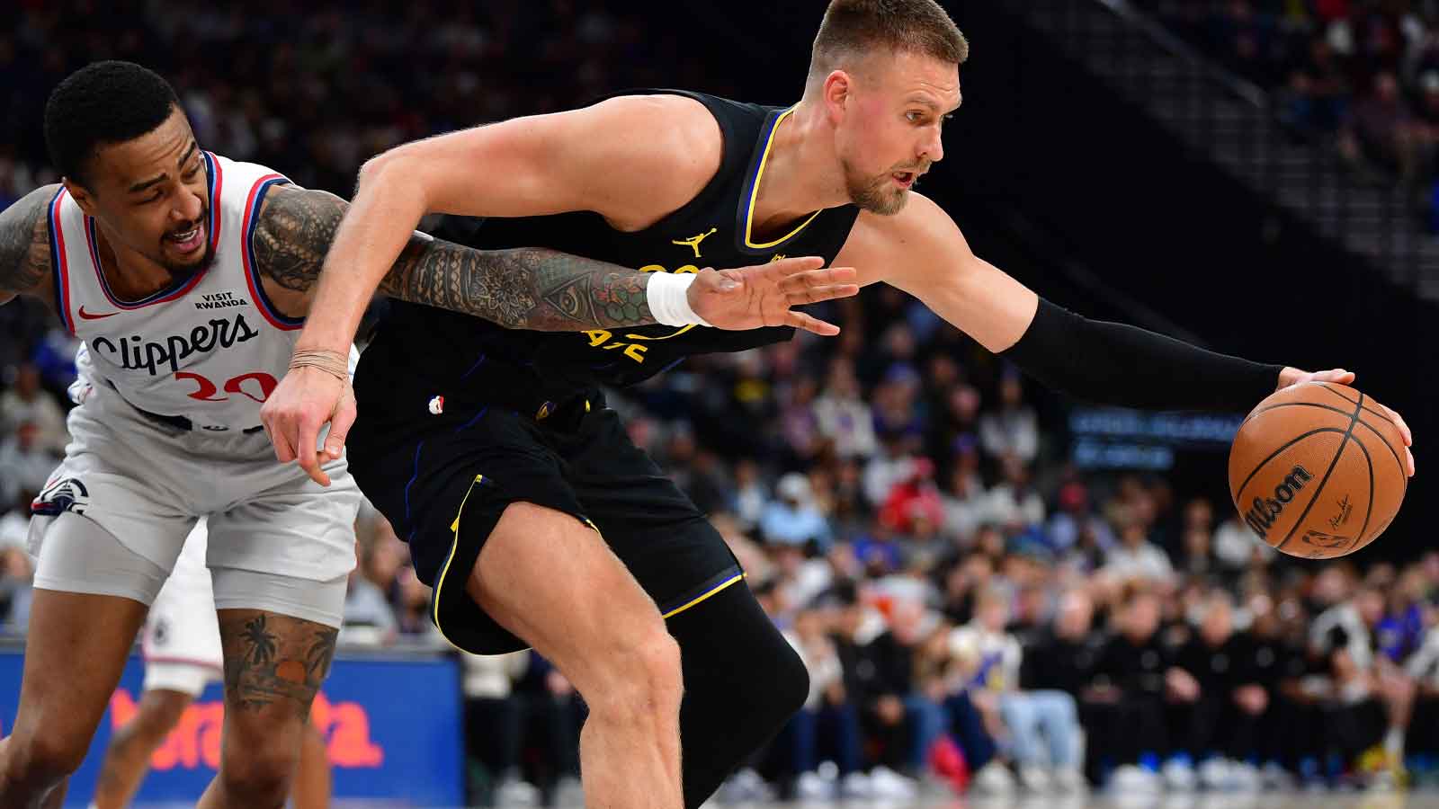 Warriors’ Kristaps Porzingis in danger of missing Suns play-in clash with injury