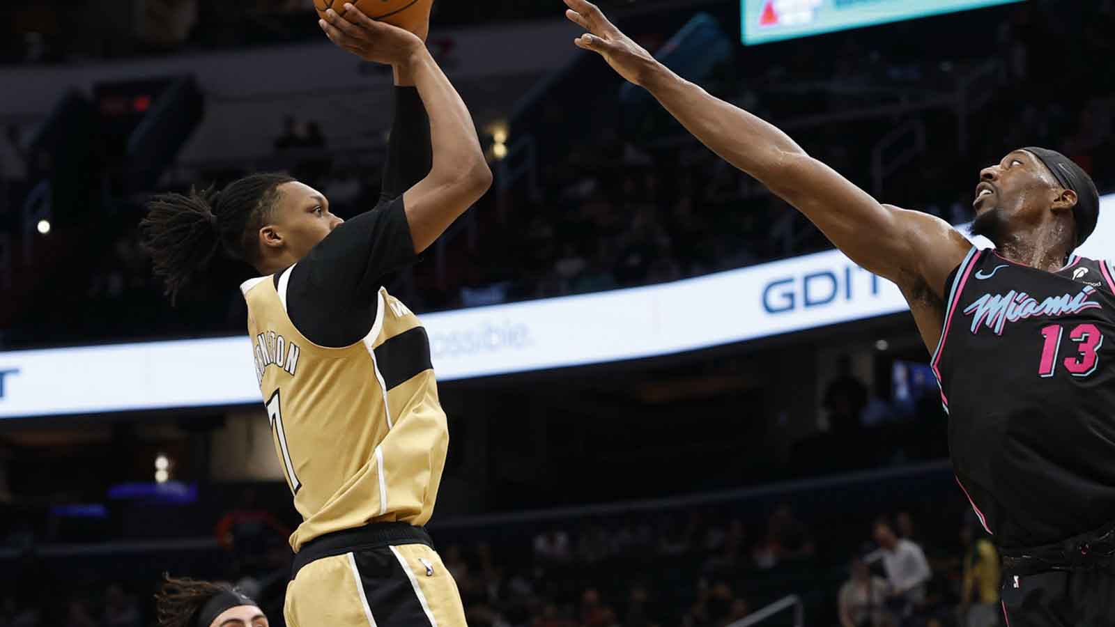 https://wp.clutchpoints.com/wp-content/uploads/2026/04/Washington-Wizards-guard-Bub-Carrington-7-shoots-the-ball-as-Miami-Heat-center-Bam-Adebayo-13-defends-in-the-second-half-at-Capital-One-Arena.jpg