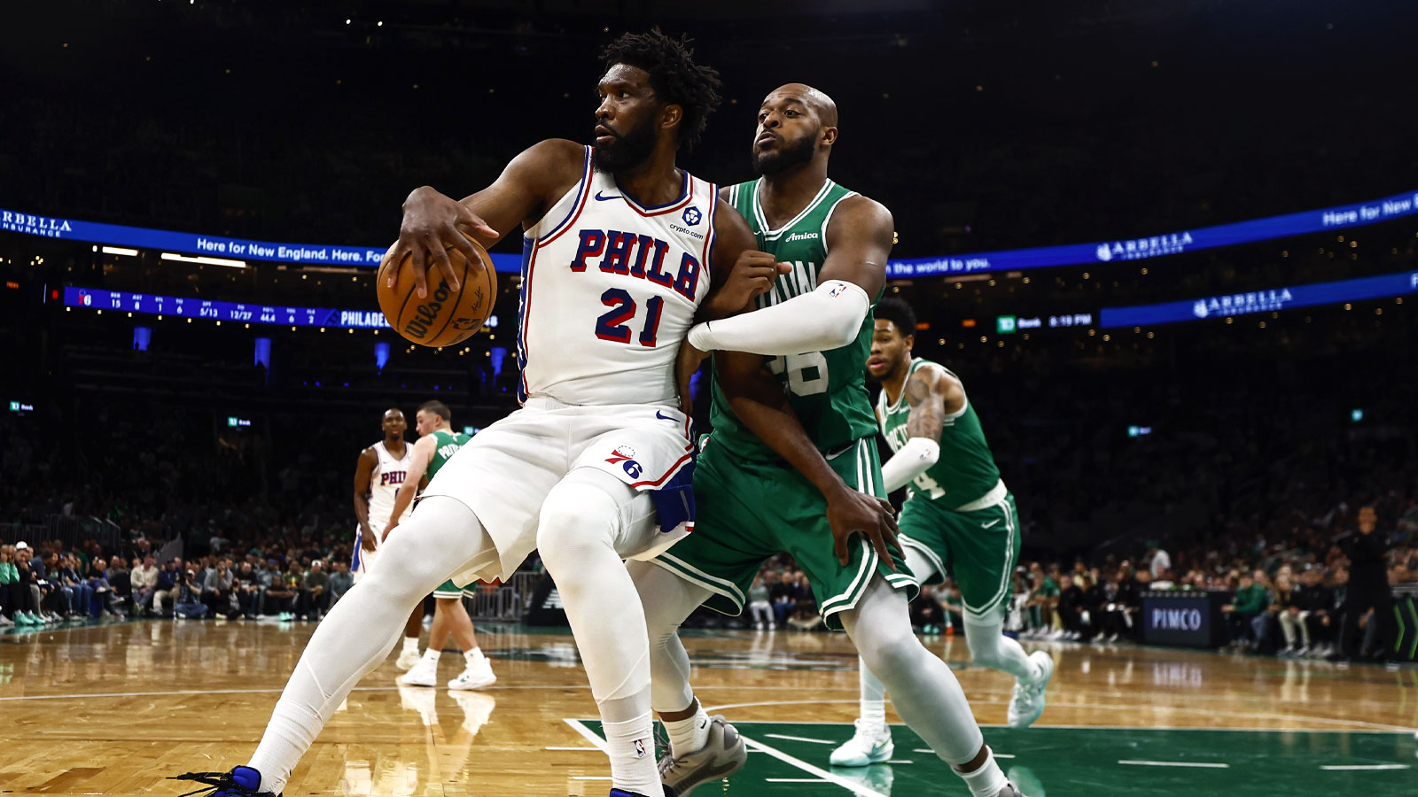 https://wp.clutchpoints.com/wp-content/uploads/2026/04/Xavier-Tillman-grabs-hold-of-Philadelphia-76ers-center-Joel-Embiid.jpg