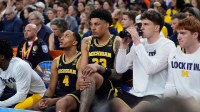 Michigan forward Yaxel Lendeborg (23) rests on the bench in the first half of their Final Four game against Arizona at Lucas Oil Stadium in Indianapolis on Saturday, April 4, 2026.