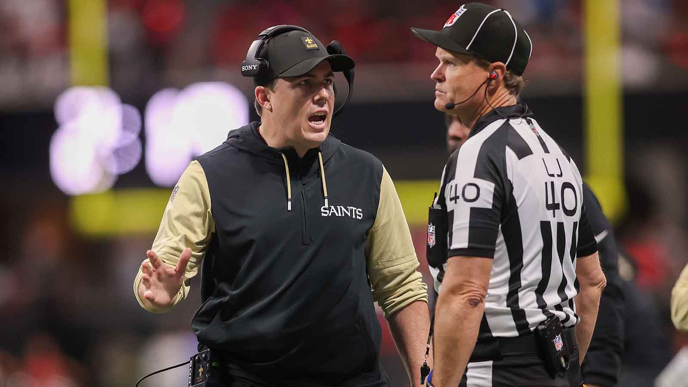 New Orleans Saints head coach Kellen Moore talks to a referee against the Atlanta Falcons in the third quarter at Mercedes-Benz Stadium.
