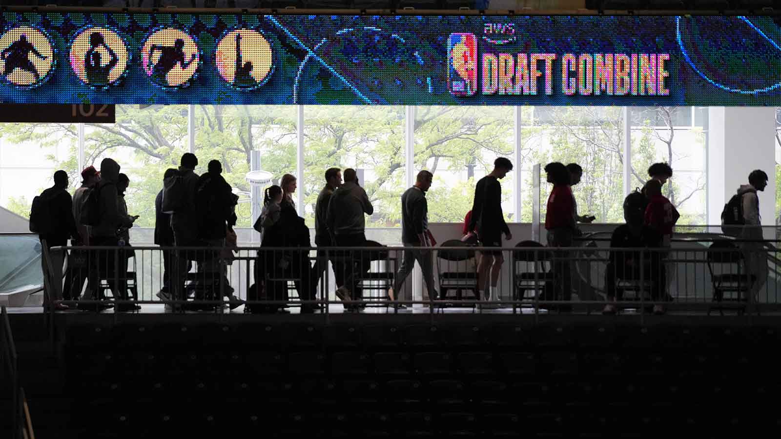 People walk through the 2026 NBA Draft Combine at Wintrust Arena.