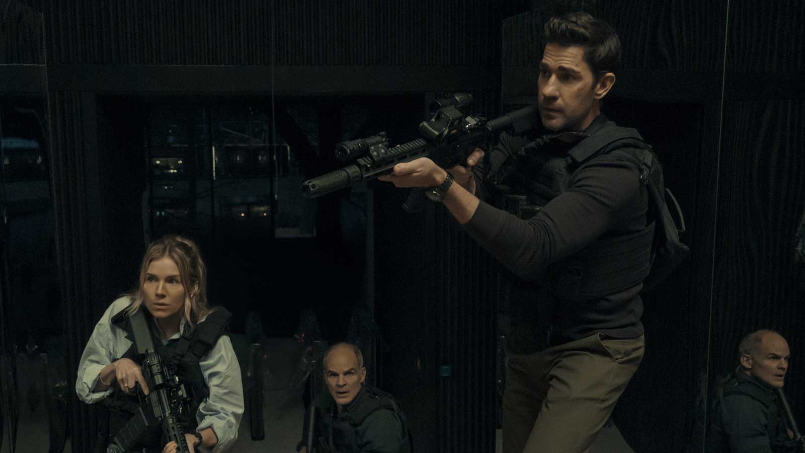 Sienna Miller, Michael Kelly, and John Krasinski in Tom Clancy's Jack Ryan: Ghost War.