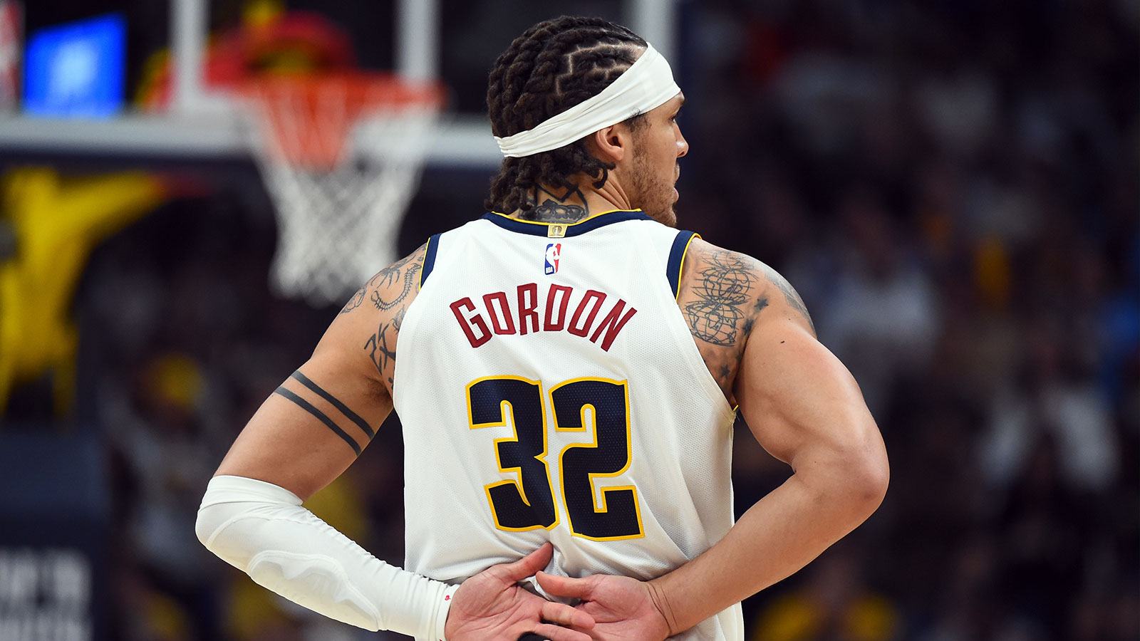 Denver Nuggets forward Aaron Gordon (32) holds his back after a play during the second half against the Minnesota Timberwolves in game one of the first round of the 2026 NBA Playoffs at Ball Arena.