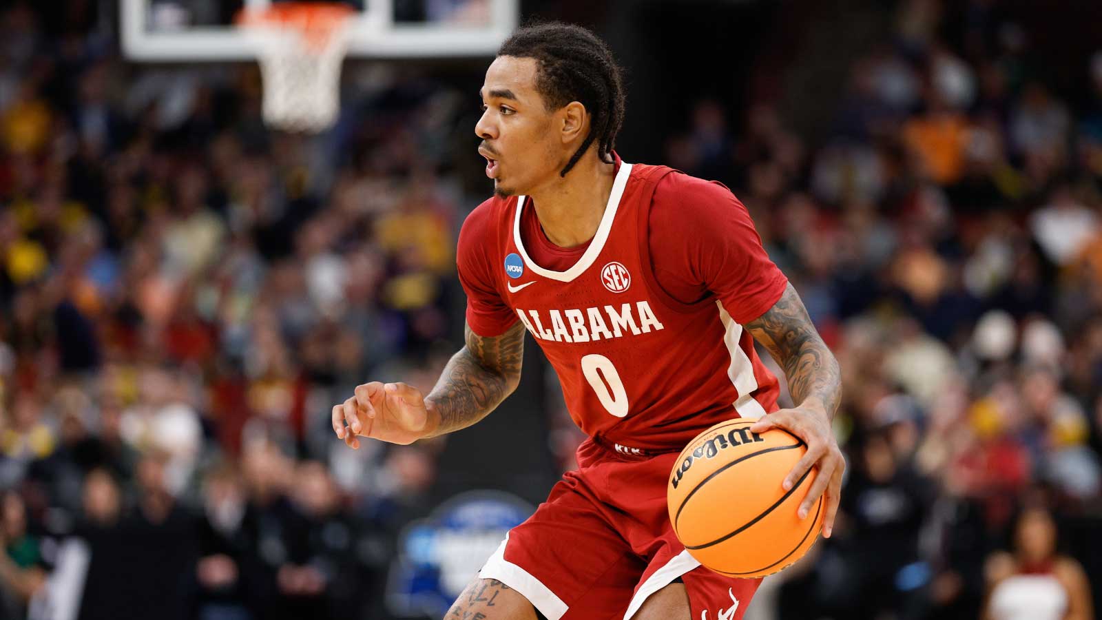 Alabama Crimson Tide guard Labaron Philon Jr. (0) controls the ball in the first half against the Michigan Wolverines during a Sweet Sixteen game of the Midwest Regional of the men's 2026 NCAA Tournament at United Center. 
