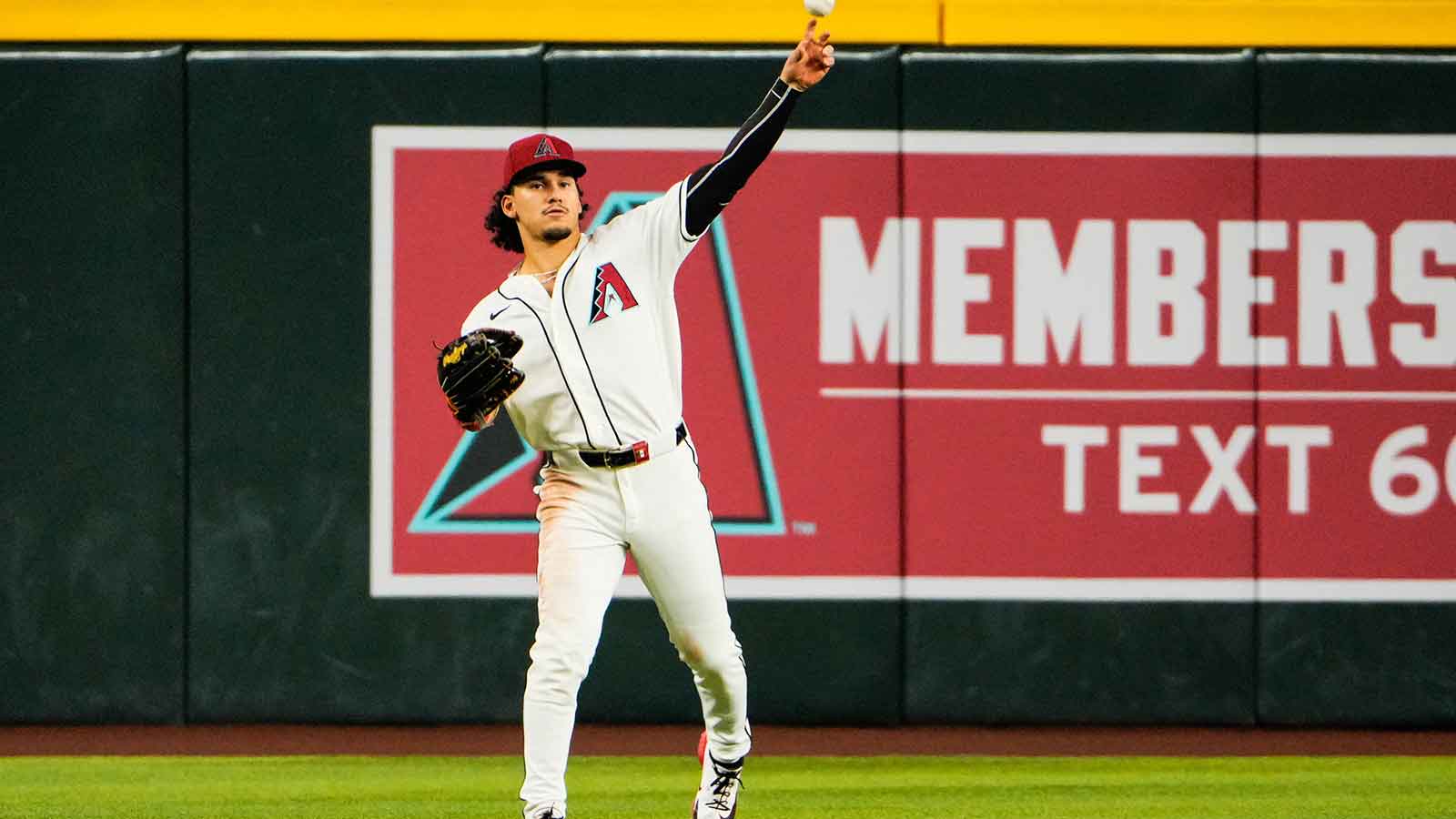 Arizona Diamondbacks center fielder Alek Thomas (5) throws the ball into the infield during the fifth inning at Chase Field against the Atlanta Braves.
