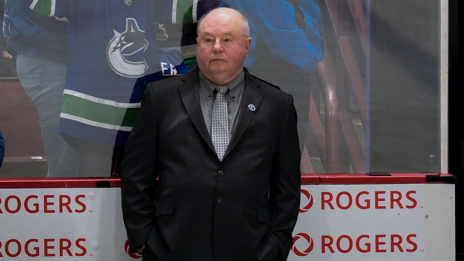 Vancouver Canucks head coach Bruce Boudreau watches from the bench during warm up prior to a game against the Colorado Avalanche at Rogers Arena.