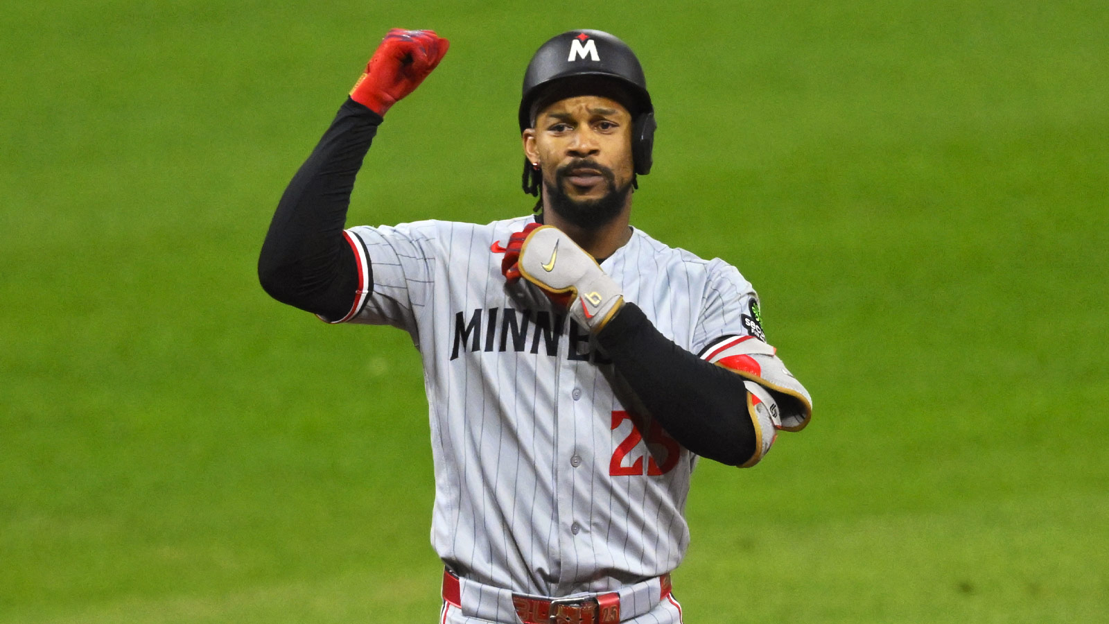Minnesota Twins center fielder Byron Buxton (25) celebrates his RBI double in the eleventh inning against the Cleveland Guardians at Progressive Field.
