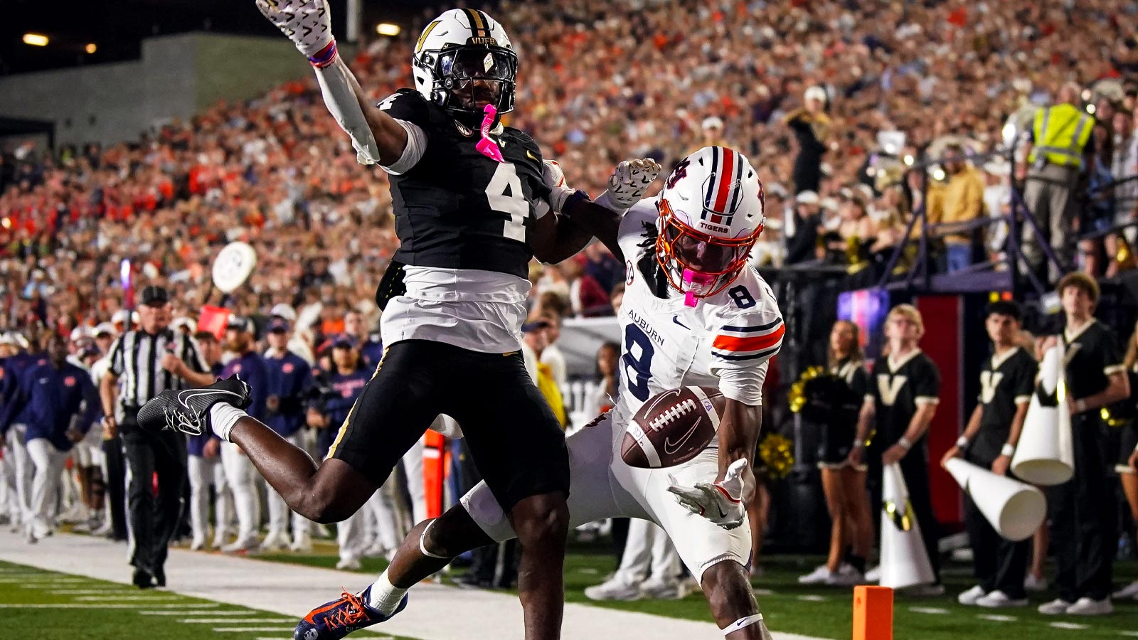 Auburn wide receiver Cam Coleman (8) receives a pass to pull in a touchdown past Vanderbilt cornerback Martel Hight (4) during the fourth quarter at FirstBank Stadium in Nashville, Tenn., Saturday, Nov. 8, 2025.