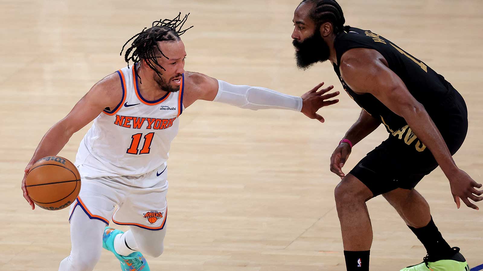 New York Knicks guard Jalen Brunson (11) controls the ball against Cleveland Cavaliers guard James Harden (1) during the fourth quarter of game one of the eastern conference finals during the 2026 NBA playoffs at Madison Square Garden.