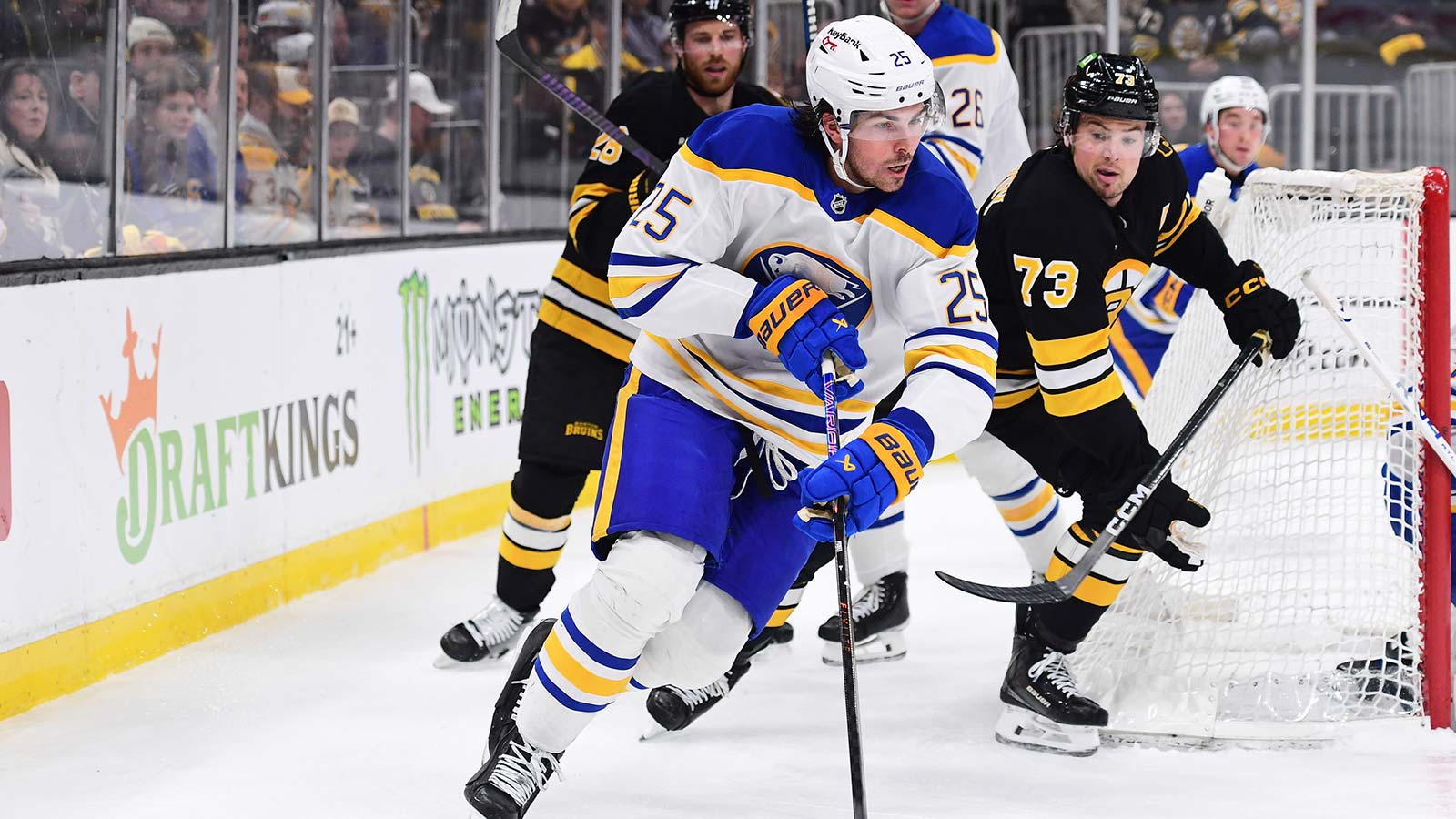 Buffalo Sabres defenseman Owen Power (25) skates with the puck ahead of Boston Bruins defenseman Charlie McAvoy (73) during the third period in game four of the first round of the 2026 Stanley Cup Playoffs at TD Garden.
