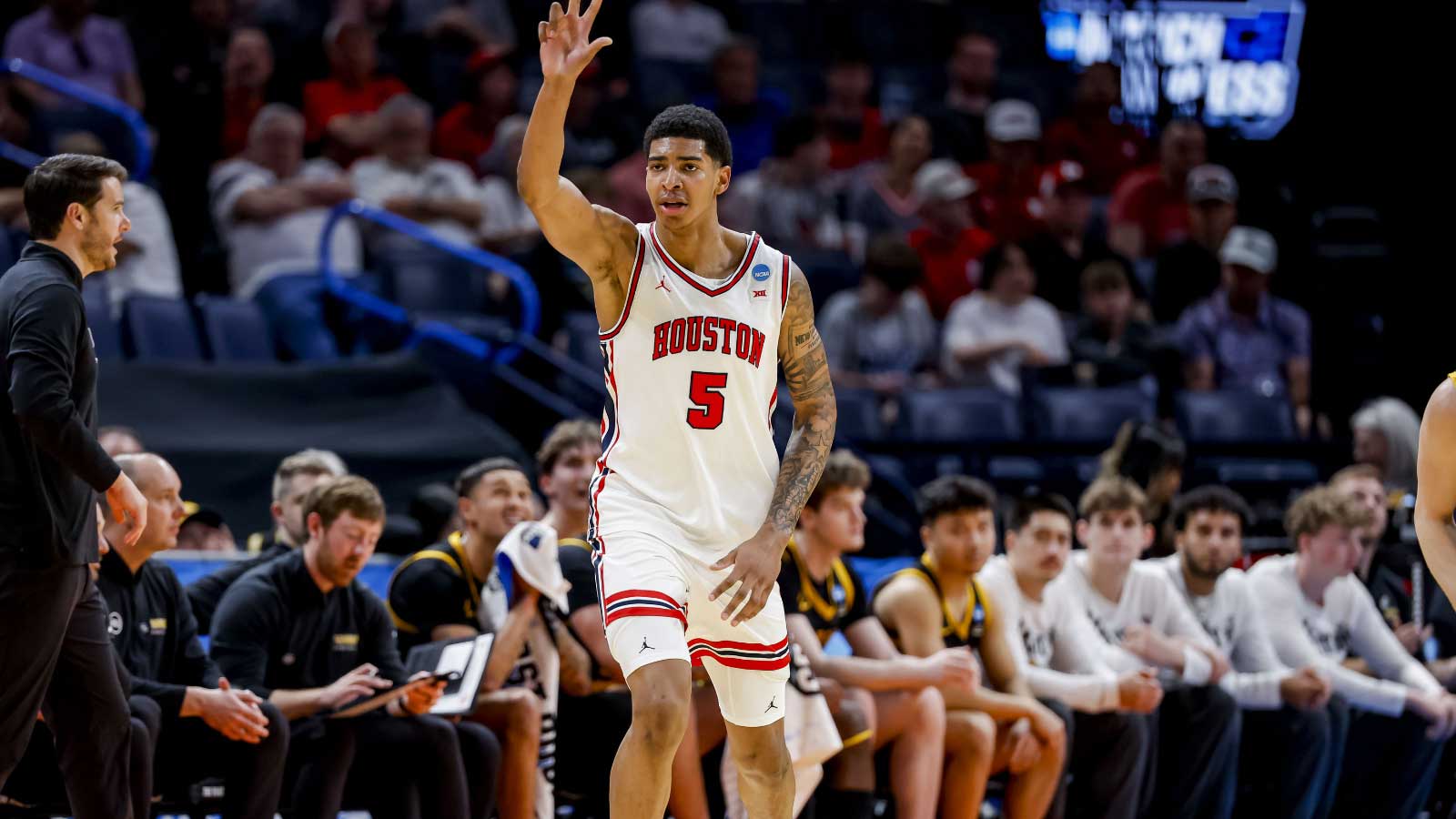 Houston Cougars center Chris Cenac Jr. (5) signals to his team during a first round game of the men's 2026 NCAA Tournament at Paycom Center. 