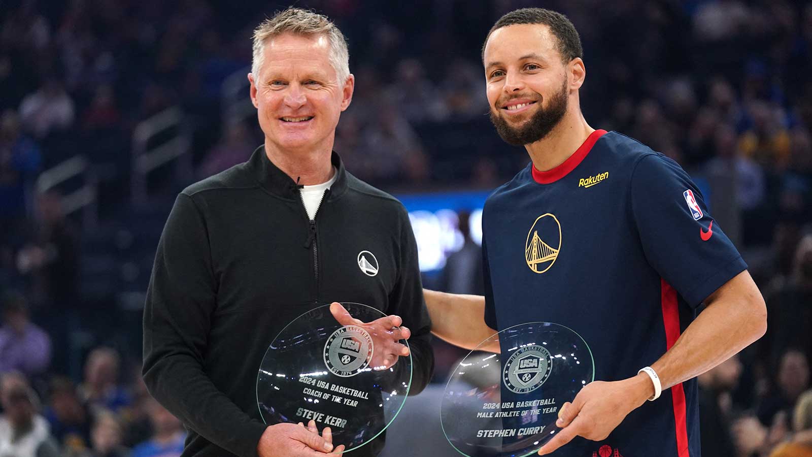 Golden State Warriors head coach Steve Kerr and guard Stephen Curry (30) are recognized as the USA Basketball head coach and male athlete of the year before the start of the game against the Oklahoma City Thunder at the Chase Center.