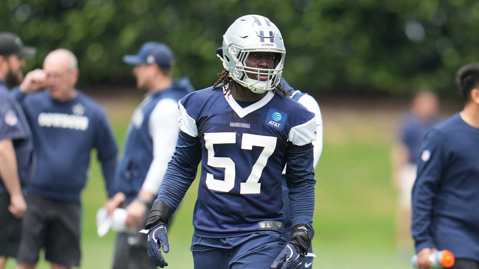 Cowboys linebacker Malachi Lawrence (57) goes through a drill during practice at the Ford Center
