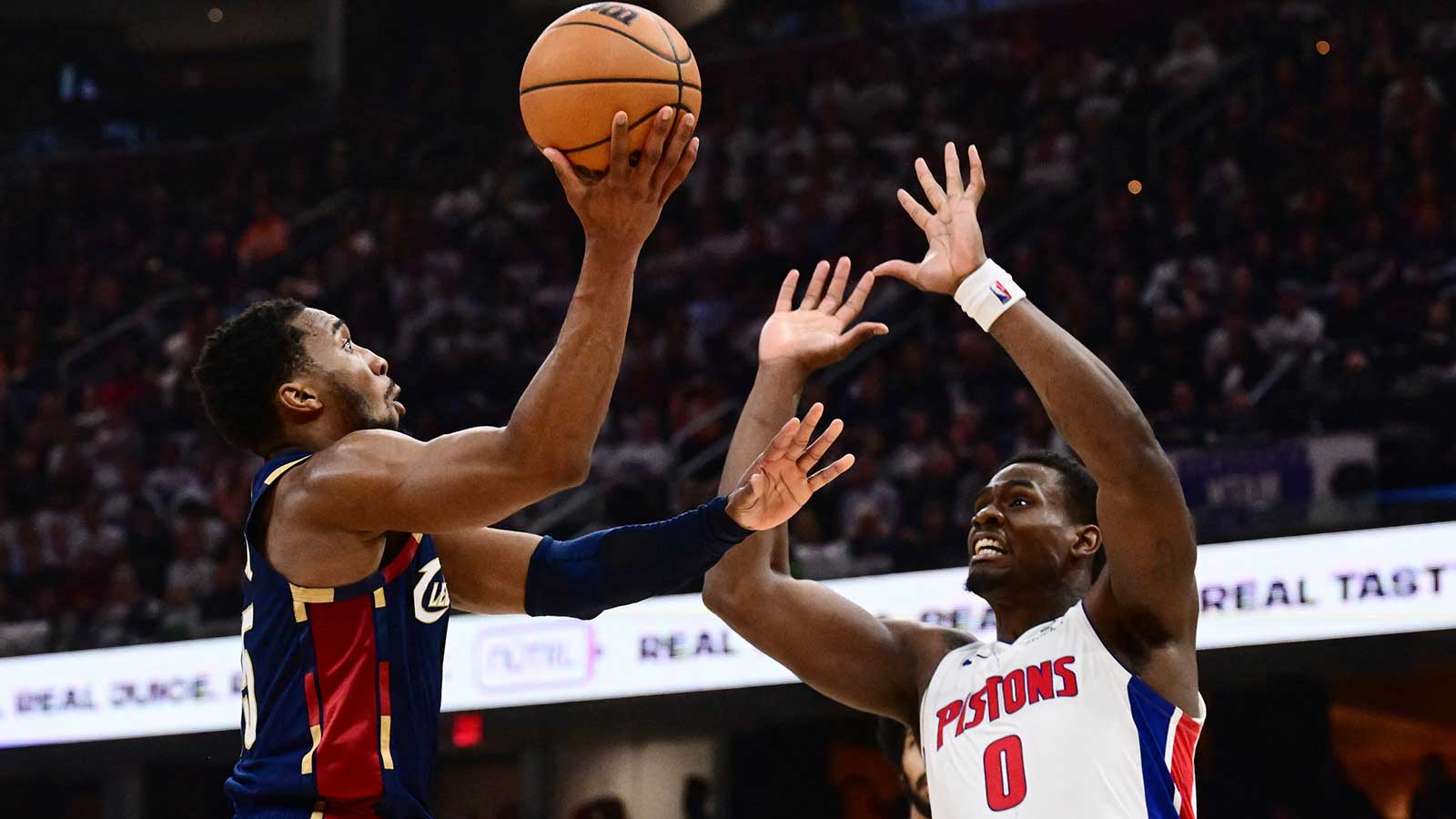 Cleveland Cavaliers guard Donovan Mitchell (45) drives to the basket against Detroit Pistons center Jalen Duren (0) during the second half of game four in the second round of the 2026 NBA Playoffs at Rocket Arena. 