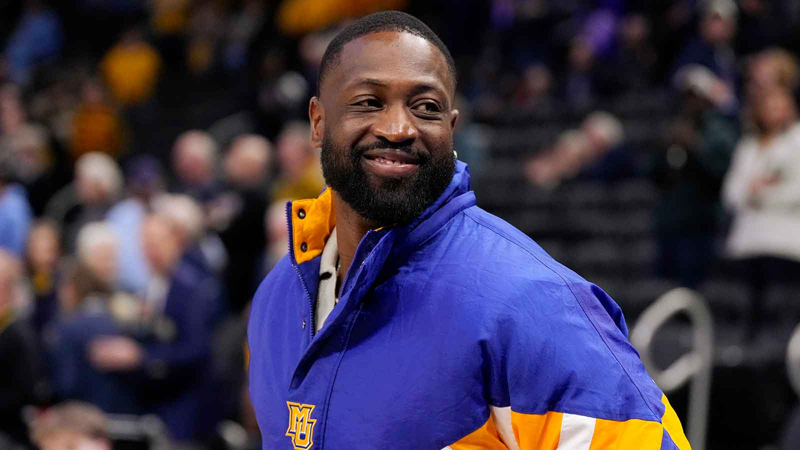 https://wp.clutchpoints.com/wp-content/uploads/2026/05/Dwyane-Wade-at-a-Marquette-game.jpg