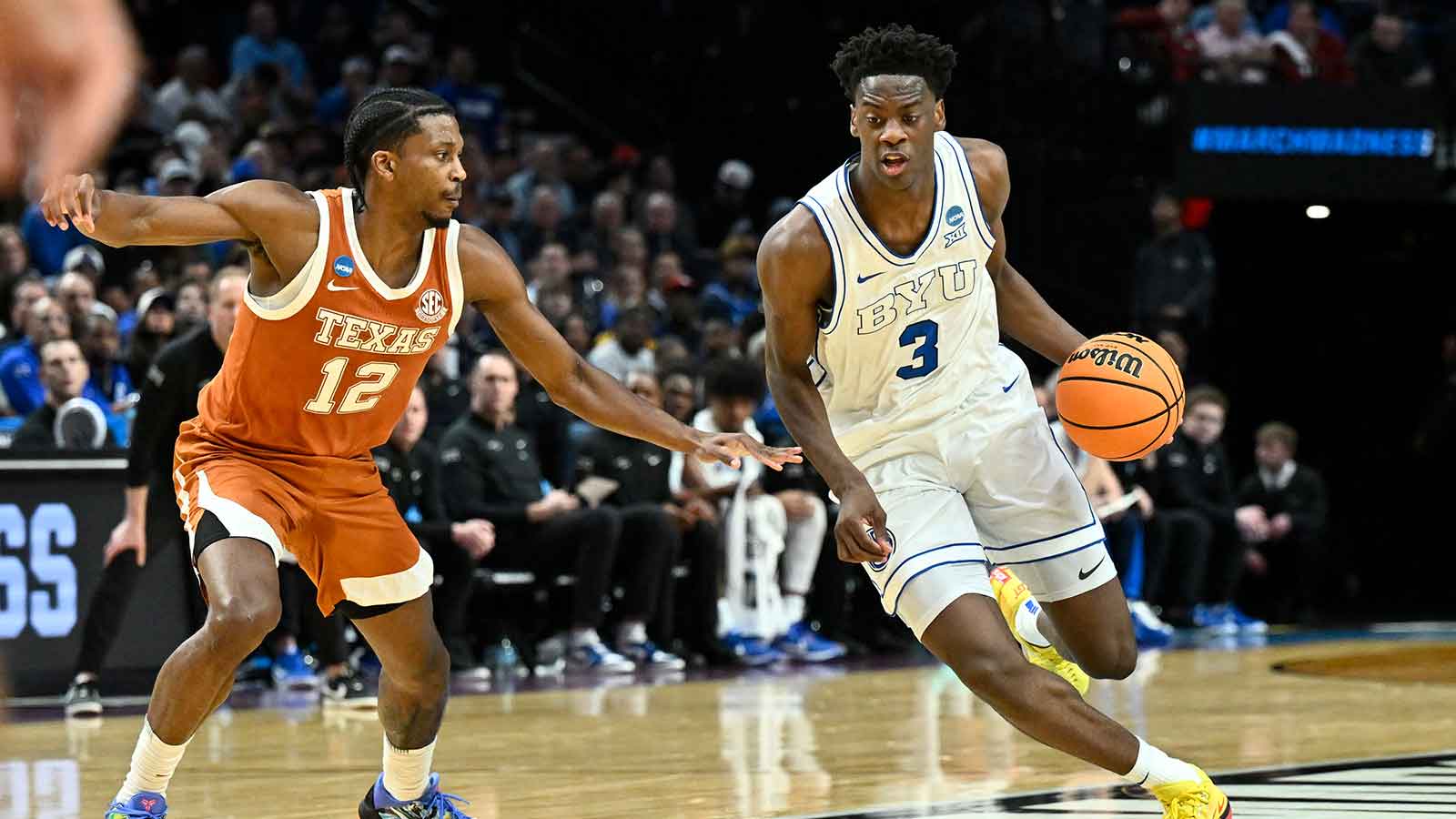 BYU Cougars forward AJ Dybantsa (3) drives against Texas Longhorns guard Tramon Mark (12) in the first half during a first round game of the men's 2026 NCAA Tournament at Moda Center.