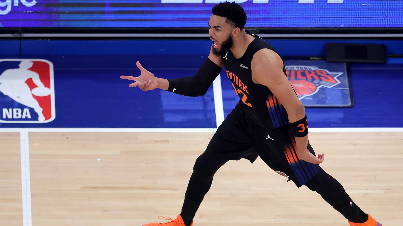 New York Knicks center Karl-Anthony Towns (32) celebrates his three point shot against the Cleveland Cavaliers during the first quarter of game two of the eastern conference finals during the 2026 NBA playoffs at Madison Square Garden.