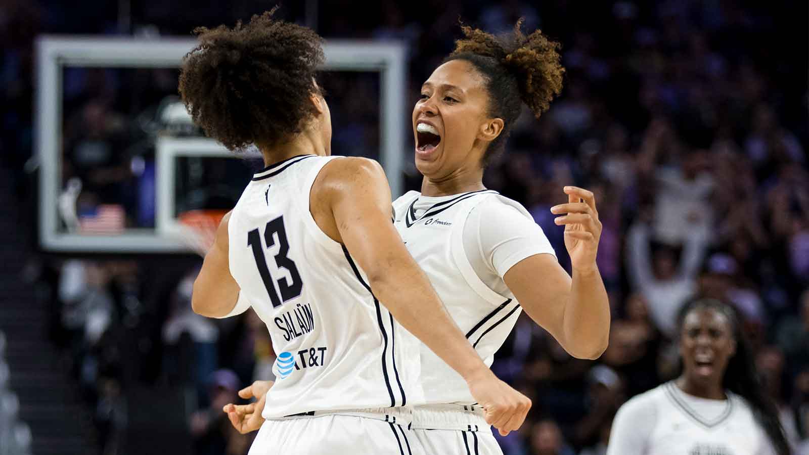 Golden State Valkyries forward Janelle Salaun (13) is congratulated by center Iliana Rupert (12) after she scored against the Dallas Wings during the second half at Chase Center. 