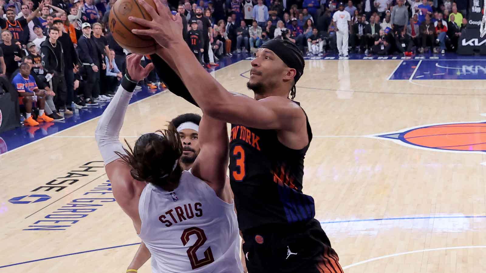 New York Knicks guard Josh Hart (3) fights for a rebound against Cleveland Cavaliers guard Max Strus (2) and center Jarrett Allen (31) during the second quarter of game two of the eastern conference finals during the 2026 NBA playoffs at Madison Square Garden.