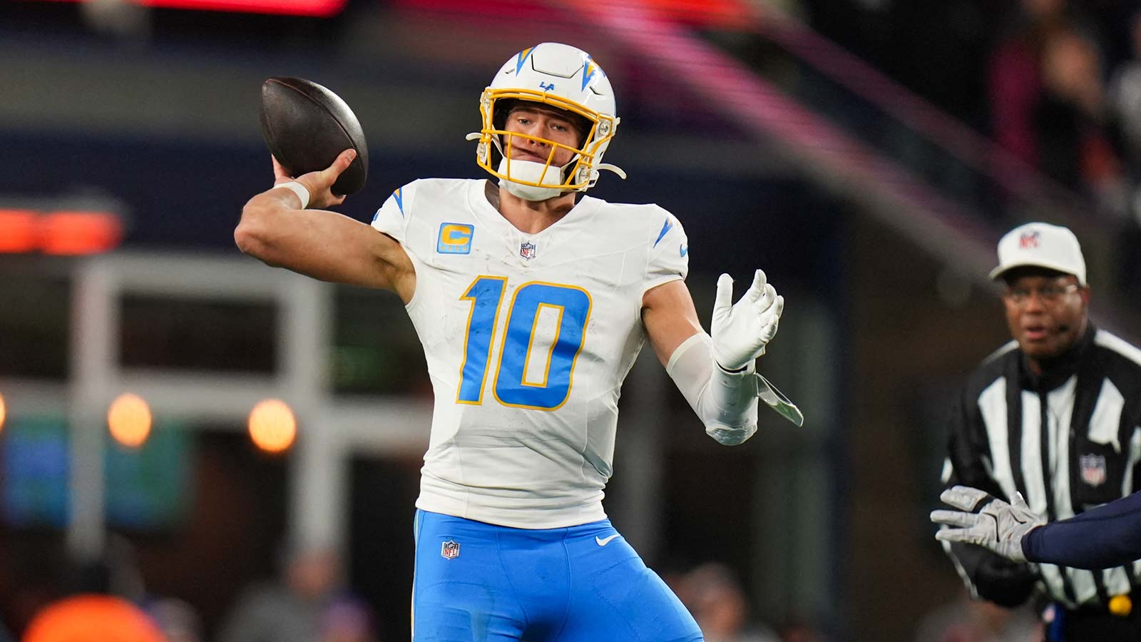 Los Angeles Chargers quarterback Justin Herbert (10) throws a pass during the third quarter against the New England Patriots in an AFC Wild Card Round game at Gillette Stadium