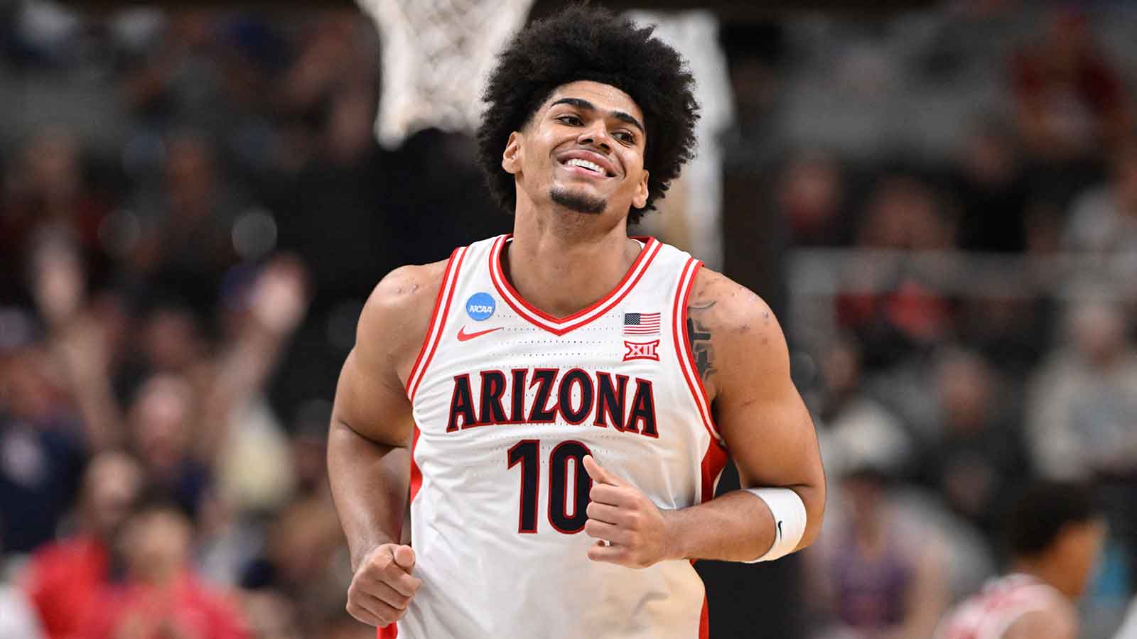 Arizona Wildcats forward Koa Peat (10) reacts after a pay against the Arkansas Razorbacks in the second half during a Sweet Sixteen game of the West Regional of the men's 2026 NCAA Tournament at SAP Center.