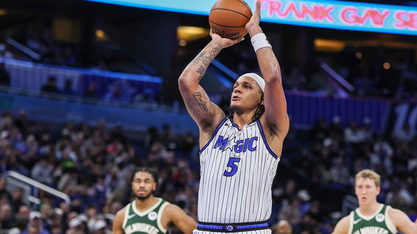 Magic forward Paolo Banchero (5) shoots a free throw after a technical foul during the second half against the Milwaukee Bucks at Kia Center