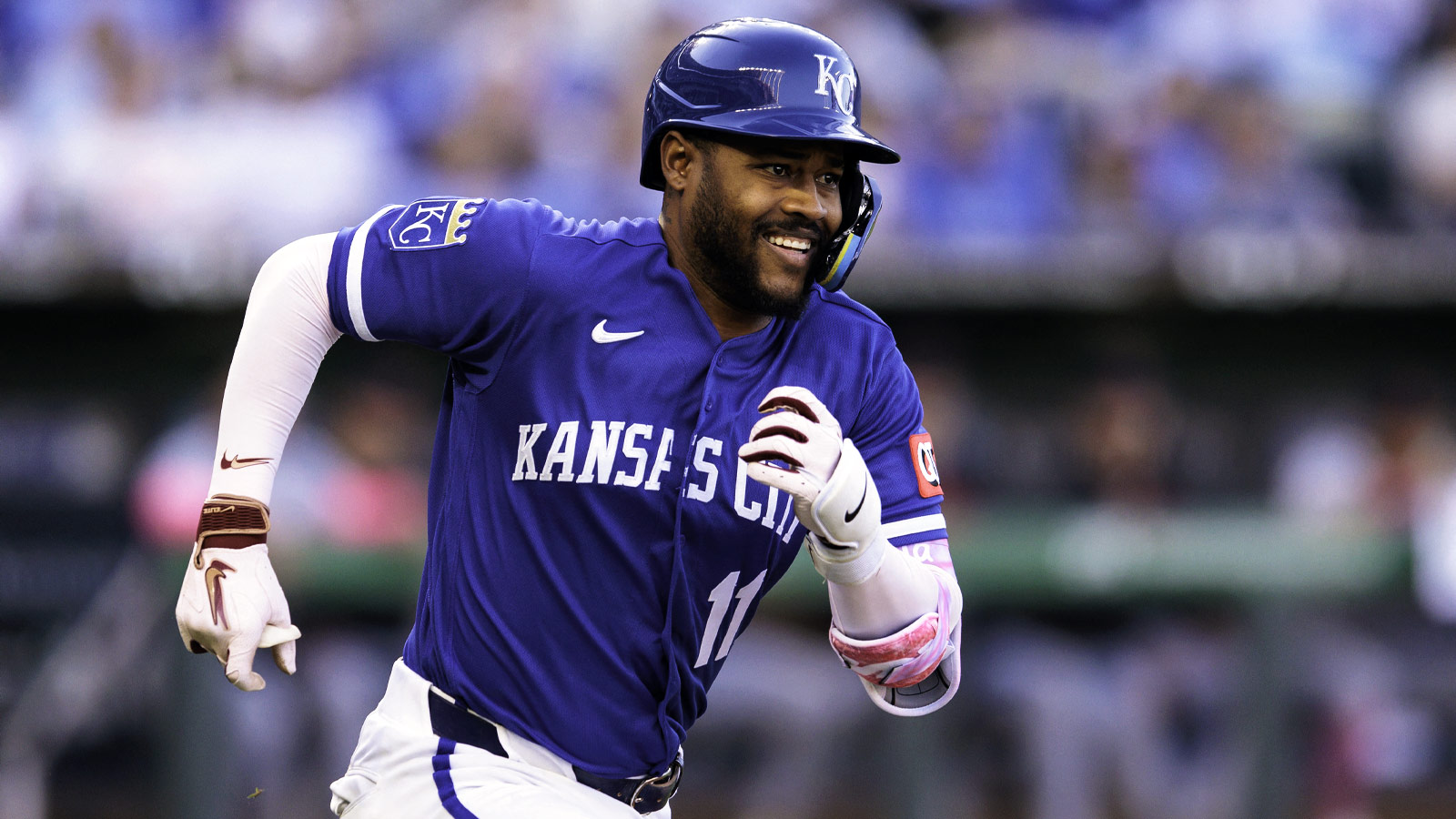 Kansas City Royals third baseman Maikel Garcia (11) runs to first base after a hit during the third inning against the Detroit Tigers at Kauffman Stadium