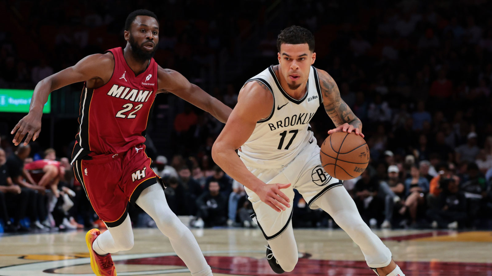 Brooklyn Nets forward Michael Porter Jr. (17) drives to the basket against Miami Heat forward Andrew Wiggins (22) during the first quarter at Kaseya Center. 