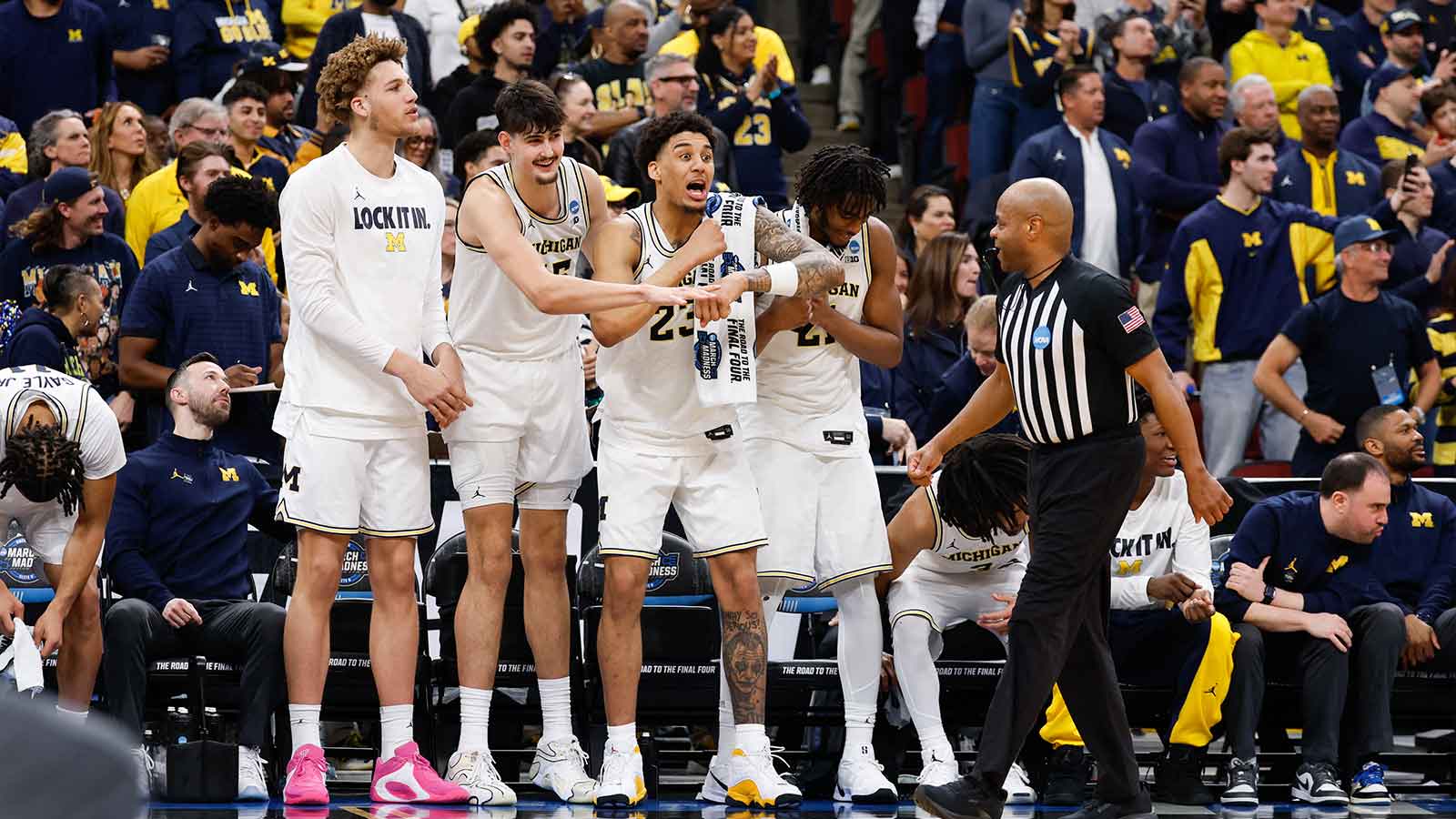 Michigan Wolverines forward Yaxel Lendeborg (23) and center Aday Mara (15) react from the bench in the second half against the Tennessee Volunteers during an Elite Eight game of the Midwest Regional of the men's 2026 NCAA Tournament at United Center. 