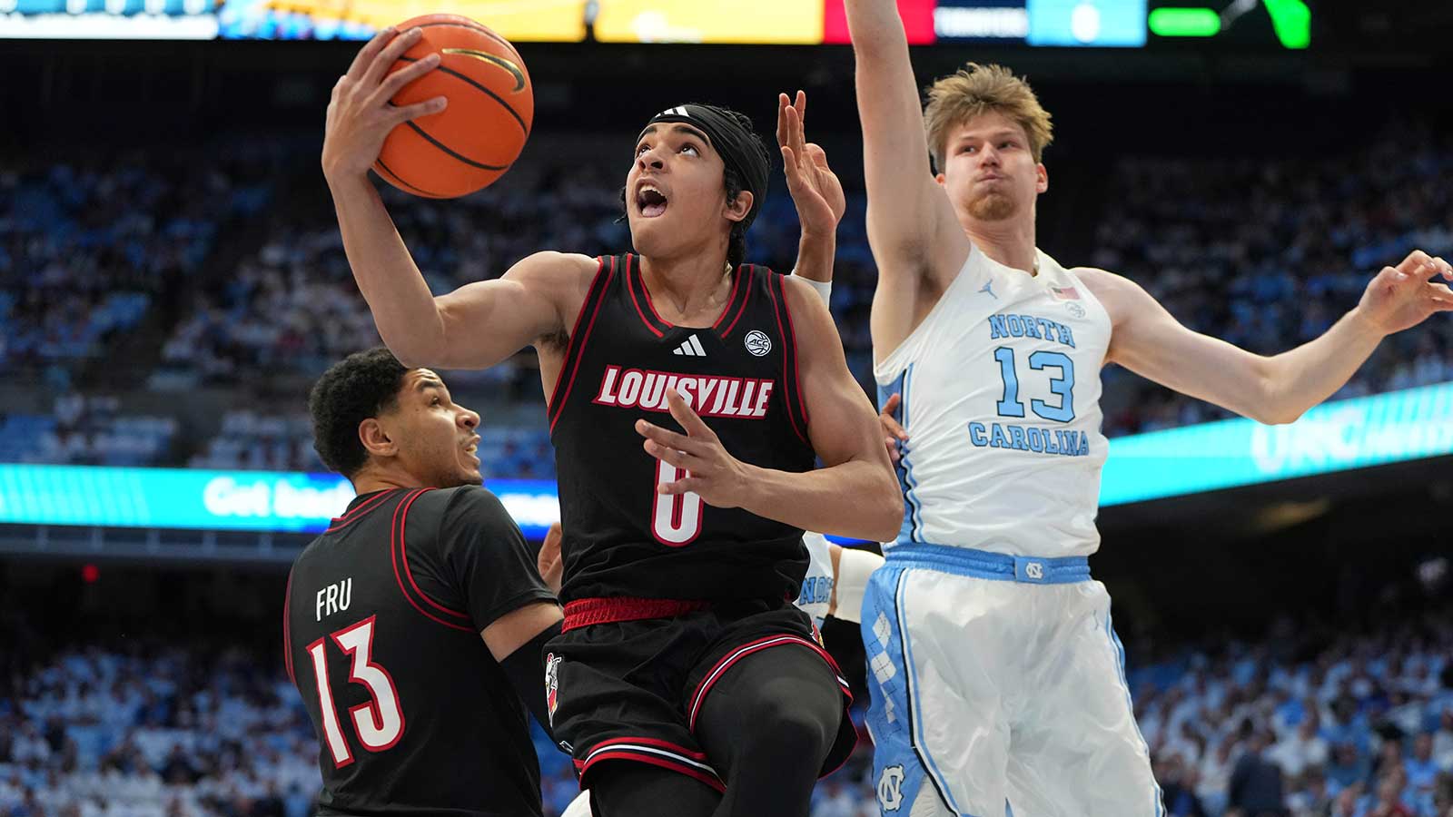 Louisville Cardinals guard Mikel Brown Jr. (0) shoots as North Carolina Tar Heels center Henri Veesaar (13) defends in the first half at Dean E. Smith Center.