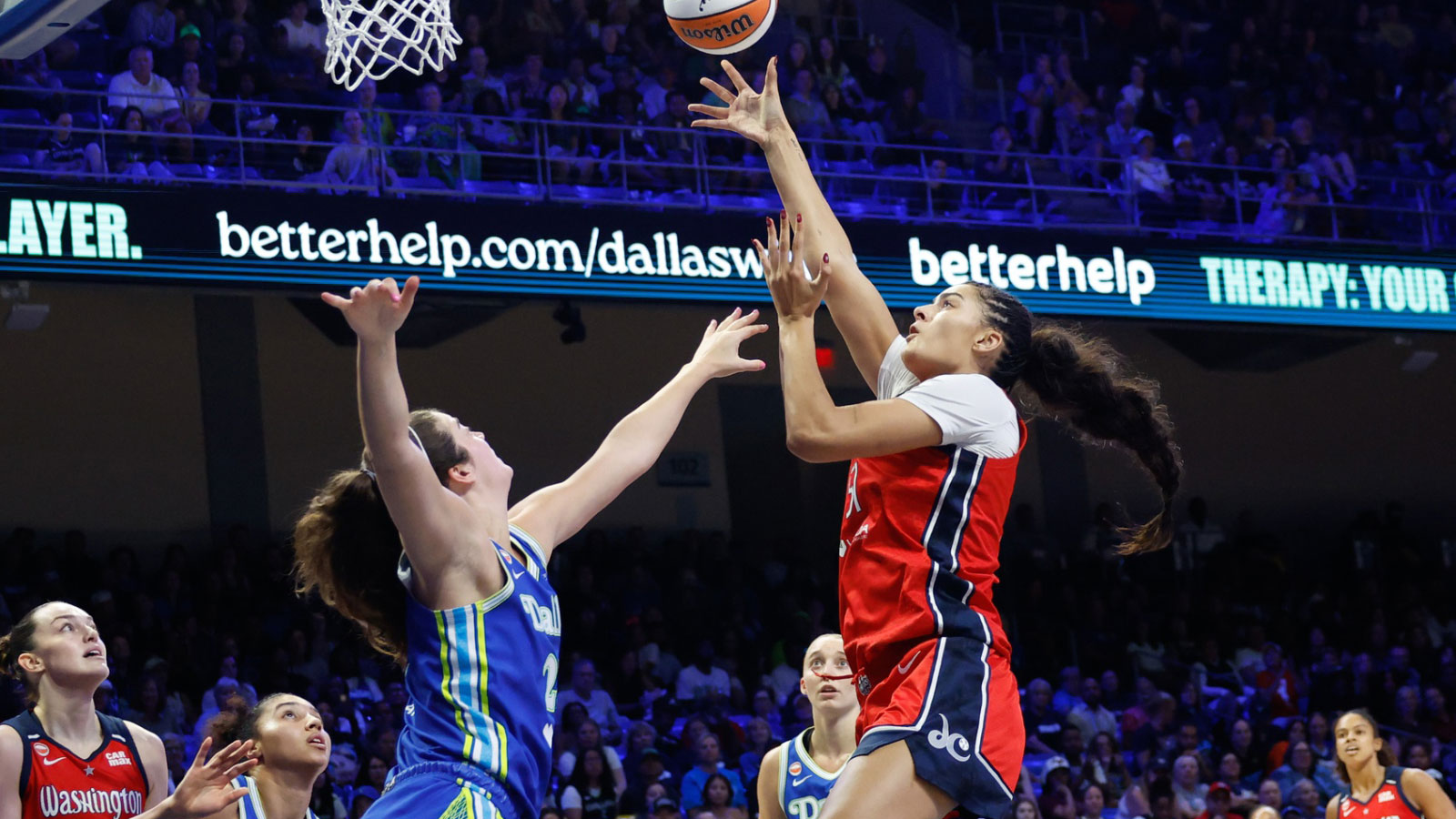 Washington Mystics center Lauren Betts (51) shoots the ball against Dallas Wings forward Maddy Siegrist (20) during the second half at College Park 