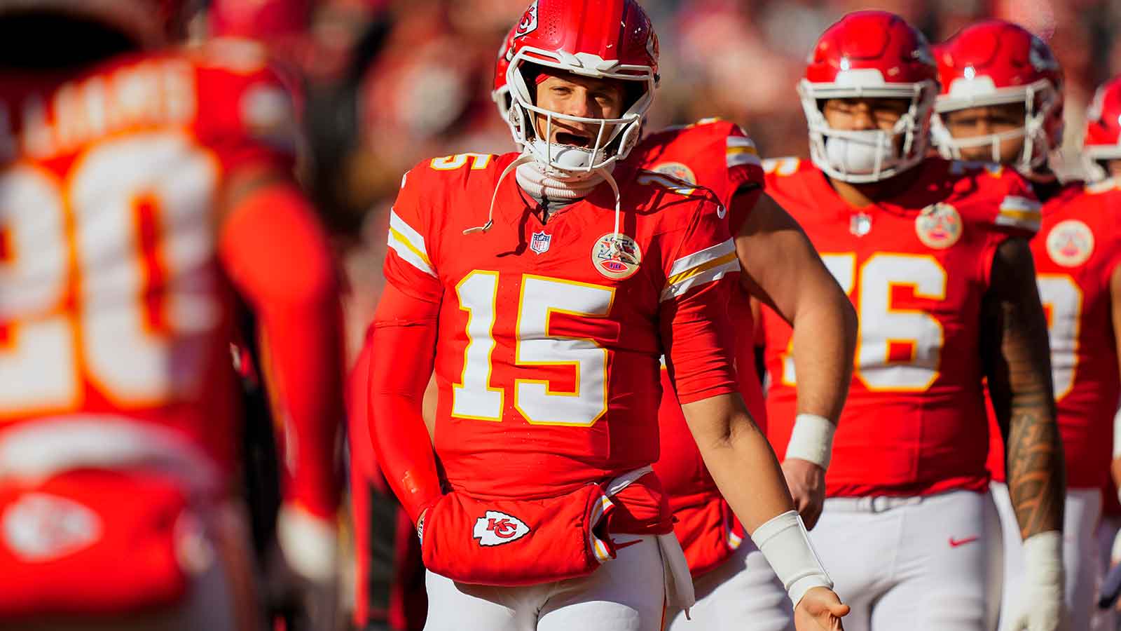 Kansas City Chiefs quarterback Patrick Mahomes (15) greets teammates prior to a game against the Los Angeles Chargers at GEHA Field at Arrowhead Stadium.