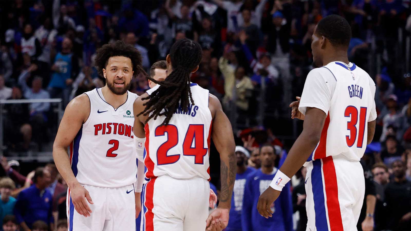 Pistons guard Daniss Jenkins (24) receives congratulations from guard Cade Cunningham (2) during the second half against the Orlando Magic during game seven of the first round of the 2026 NBA Playoffs at Little Caesars Arena