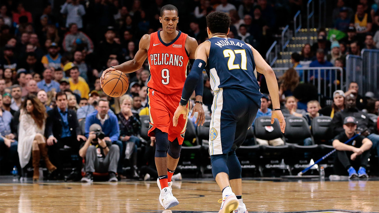 Denver Nuggets guard Jamal Murray (27) guards New Orleans Pelicans guard Rajon Rondo (9) in the fourth quarter at the Pepsi Center.