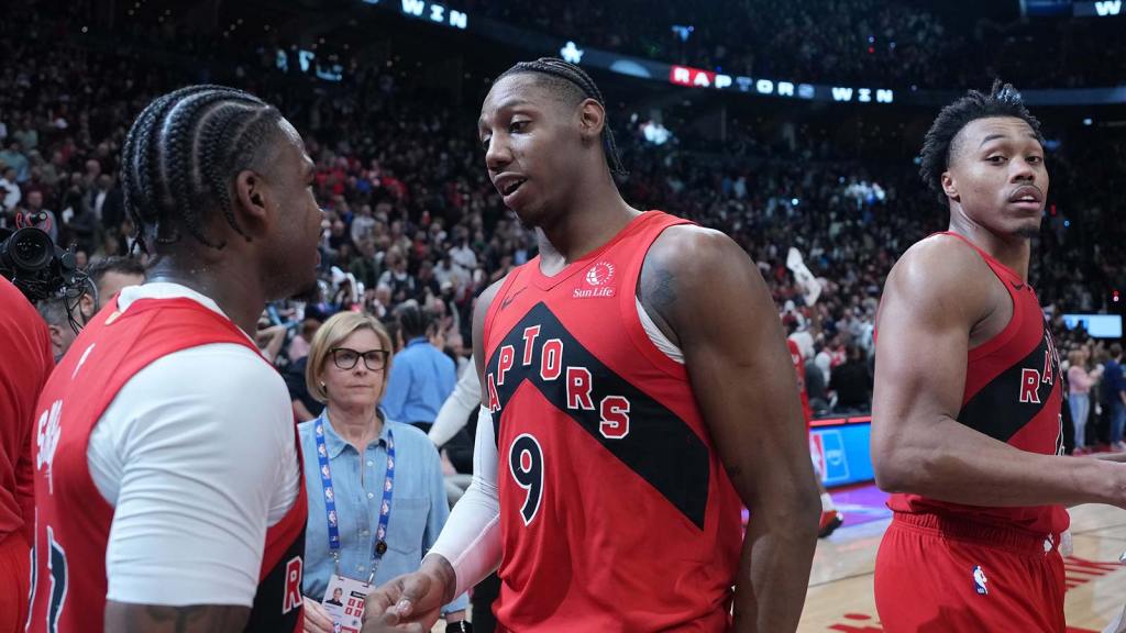 Raptors forward RJ Barrett (9) shakes hands with guard Jamal Shead (23) after scoring the winning basket against the Cleveland Cavaliers during the overtime period in game six of the first round of the 2026 NBA Playoffs at Scotiabank Arena