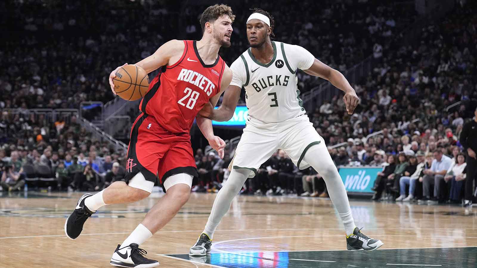 Rockets center Alperen Sengun (28) drives against Milwaukee Bucks center Myles Turner (3) in the first half at Fiserv Forum