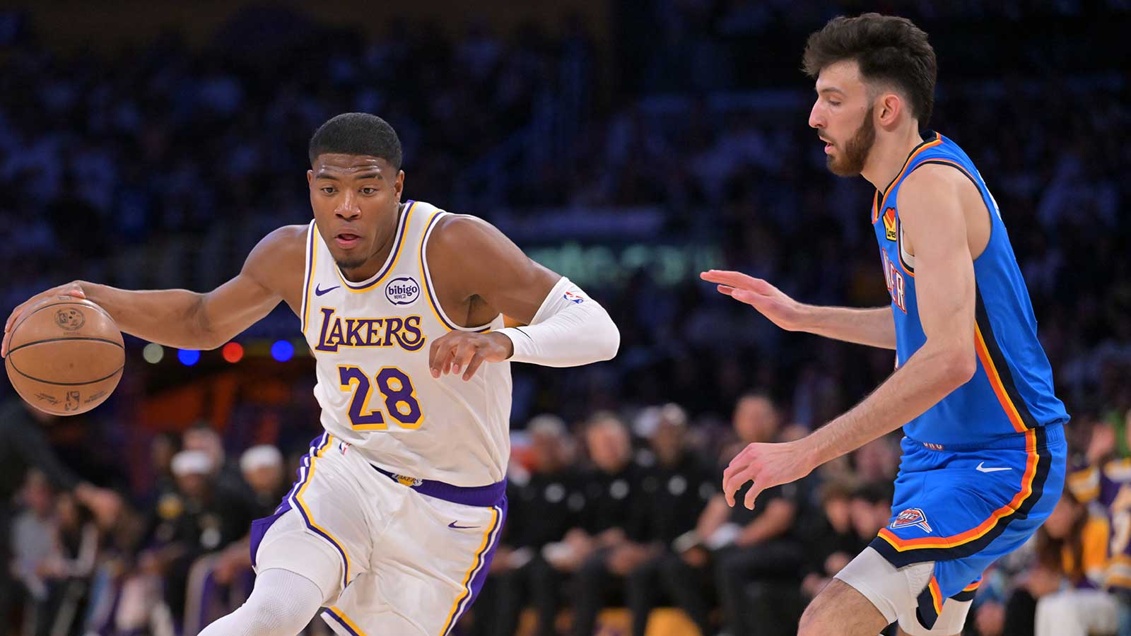 Los Angeles Lakers forward Rui Hachimura (28) is defended by Oklahoma City Thunder center Chet Holmgren (7) during the first quarter of game three of the second round of the 2026 NBA Playoffs at Crypto.com Arena.
