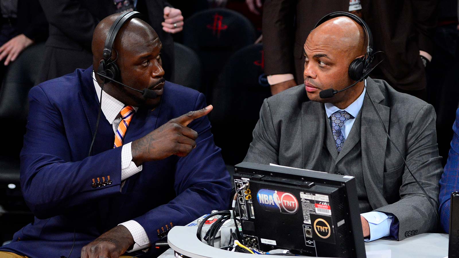 TNT broadcaster Shaquille O'Neal (left) and Charles Barkley talk during the 2013 NBA All-Star slam dunk contest at the Toyota Center.